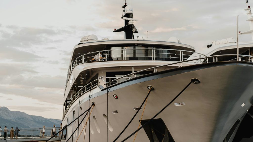 a boat is docked next to a body of water