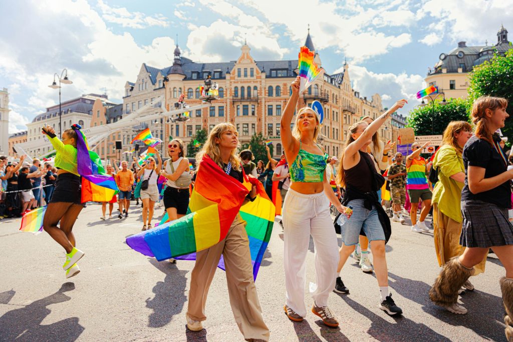 People are celebrating pride with rainbow flags.